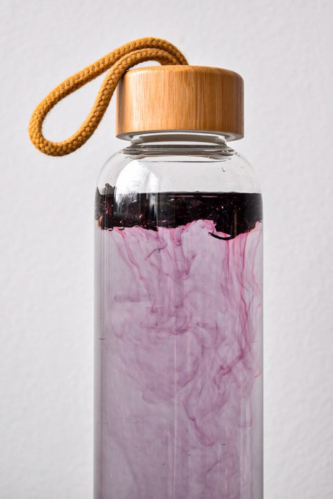 Glass water bottle with strap