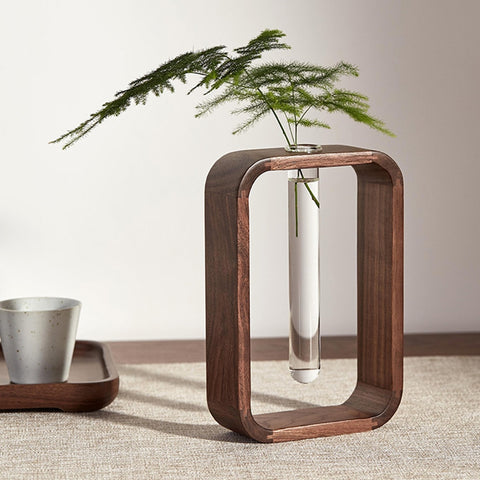 glass and wood flower vase