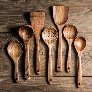 set of different wooden cooking utensils