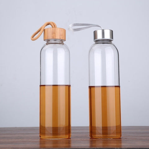 Reusable drinking bottle made of borosilicate glass with bamboo or steel lids