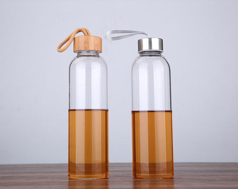 Reusable glass bottle with stainless steel or bamboo lids