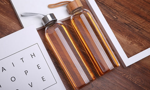Simple minimalist reusable glass water bottles