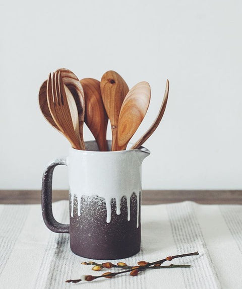 wooden kitchen utensils and wooden chopping boards