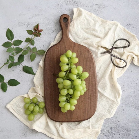 Walnut and acacia wood cutting boards, utensils, & cookware