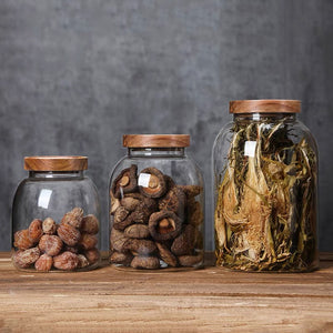 set of large glass storage jars with wood lid